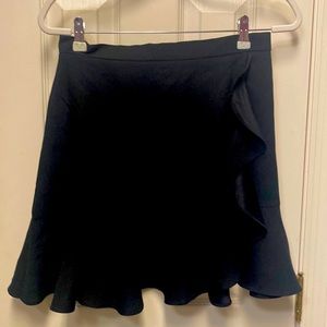 black skirt with ruffle detail. Perfect for work